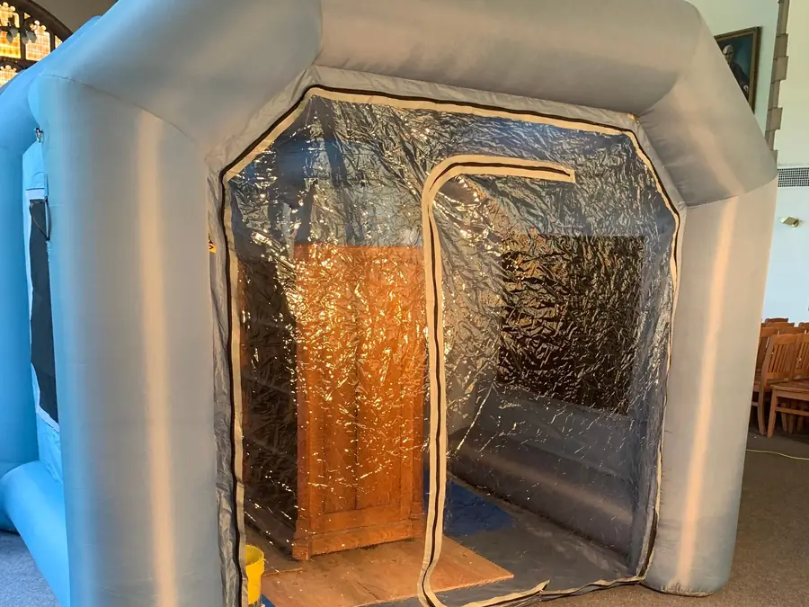 Portable spray enclosure set up for on-site refinishing work